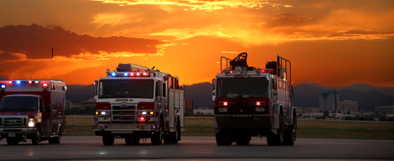Fleet of Fire Engines Driving at Sunset